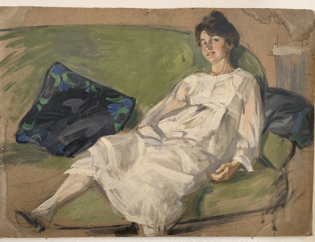 Reclining Woman in White on a Green Sofa