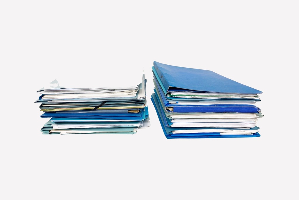 Stacks of Blue Office Folders and Documents