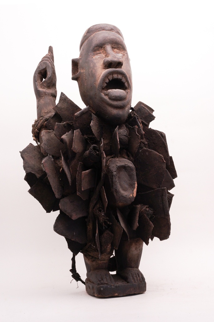 Ceremonial Wooden Figure with Textured Accents