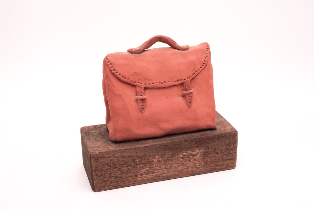 Clay Satchel on Wooden Base