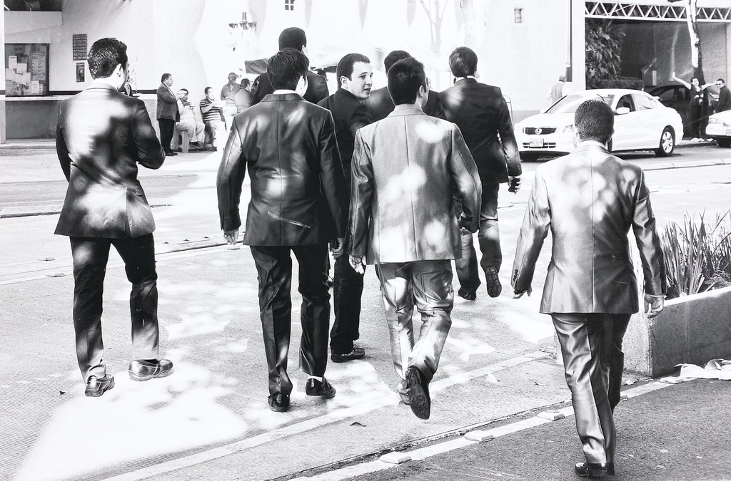Businessmen Walking in Sunlit Street Scene