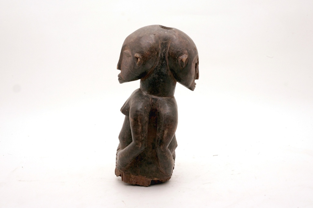 Weathered Wooden Dual-Headed Figurine