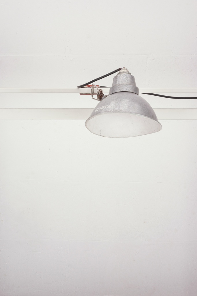 Industrial Silver Clamp Light on Minimal White Wall