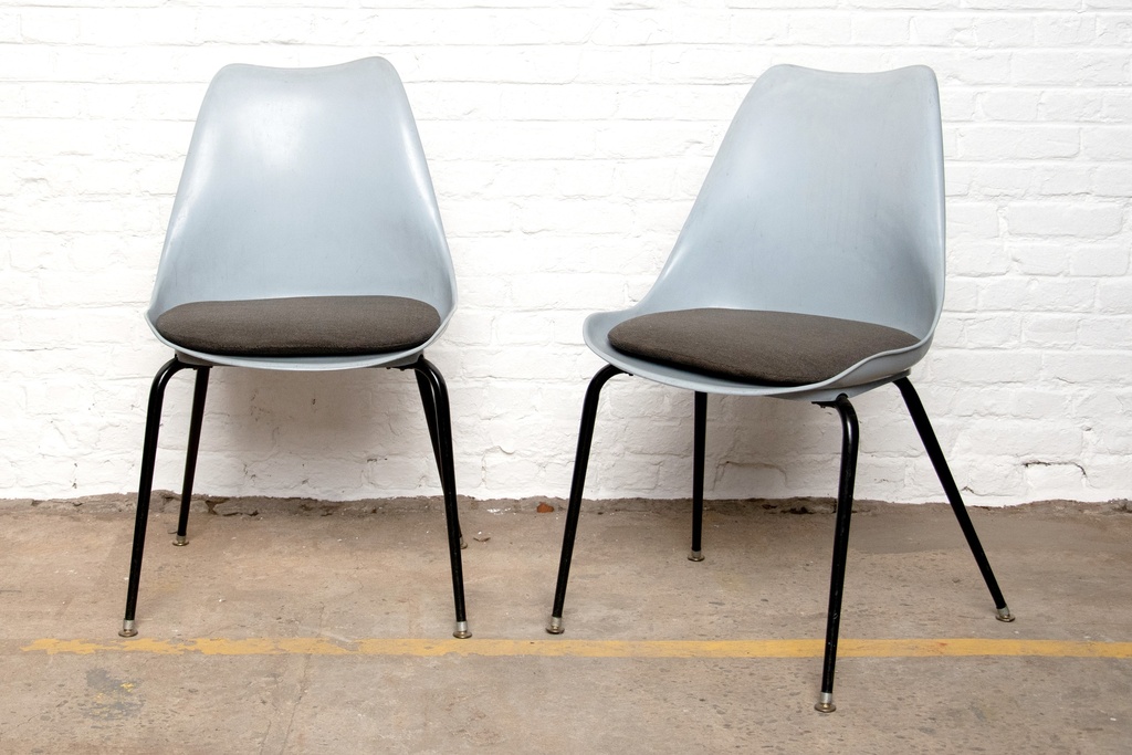 Mid-Century Modern Molded Plastic Chairs with Black Metal Legs and Cushioned Seats