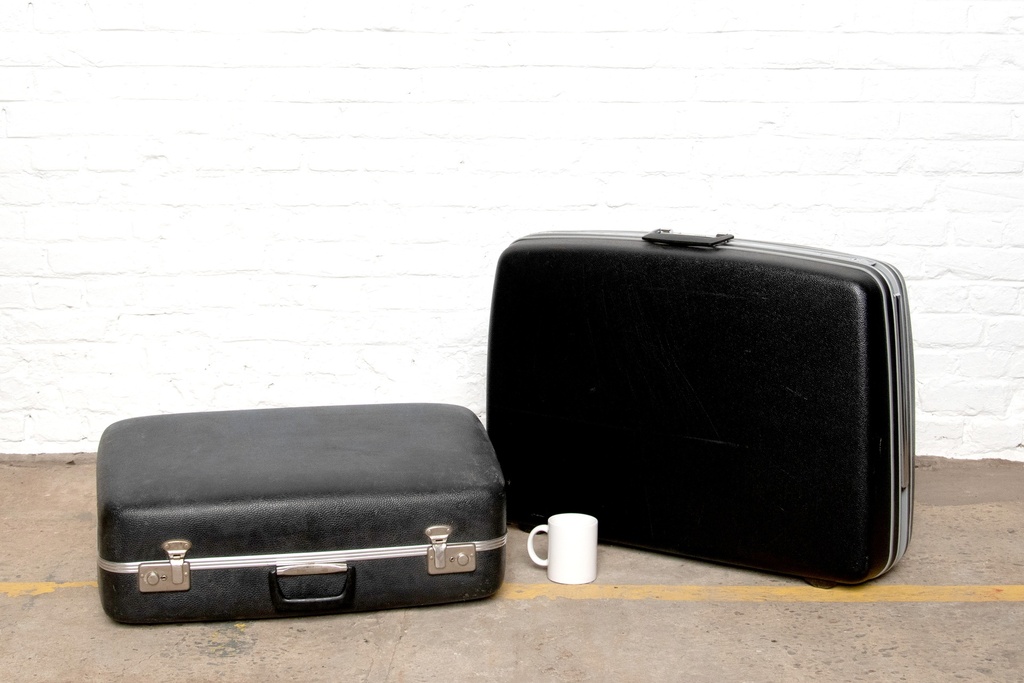 Vintage Black Hard-Shell Suitcases with White Coffee Mug