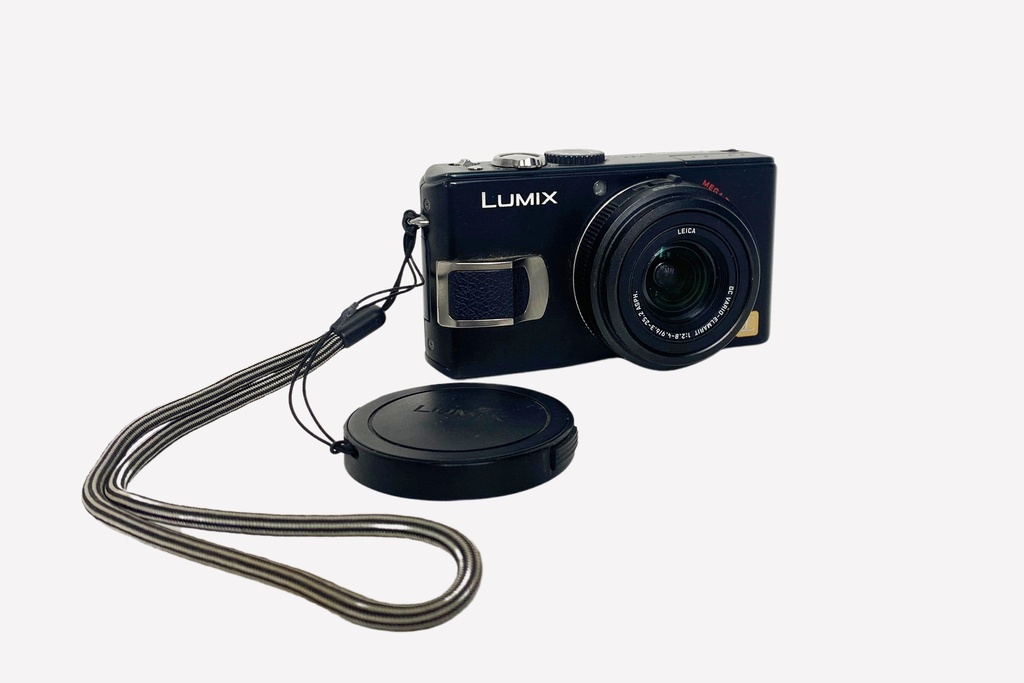 Compact Black Digital Camera with Wrist Strap and Lens Cap