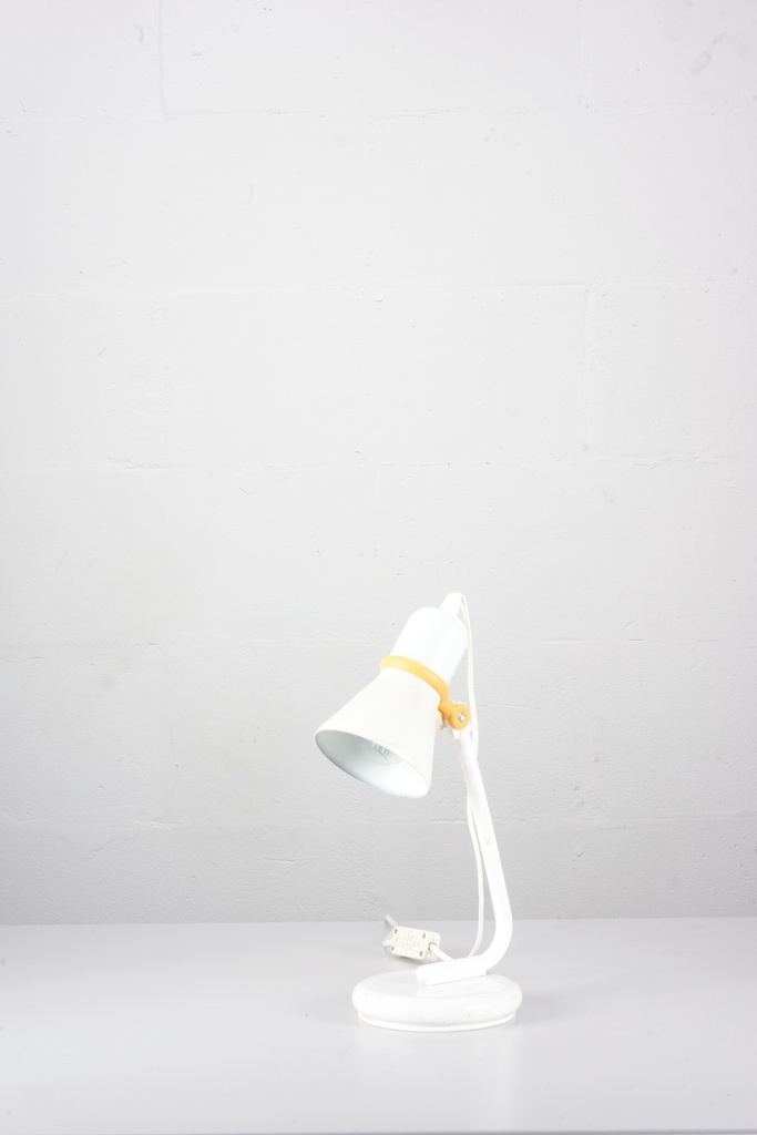 White Vintage Desk Lamp with Yellow Accent on Minimalist Background
