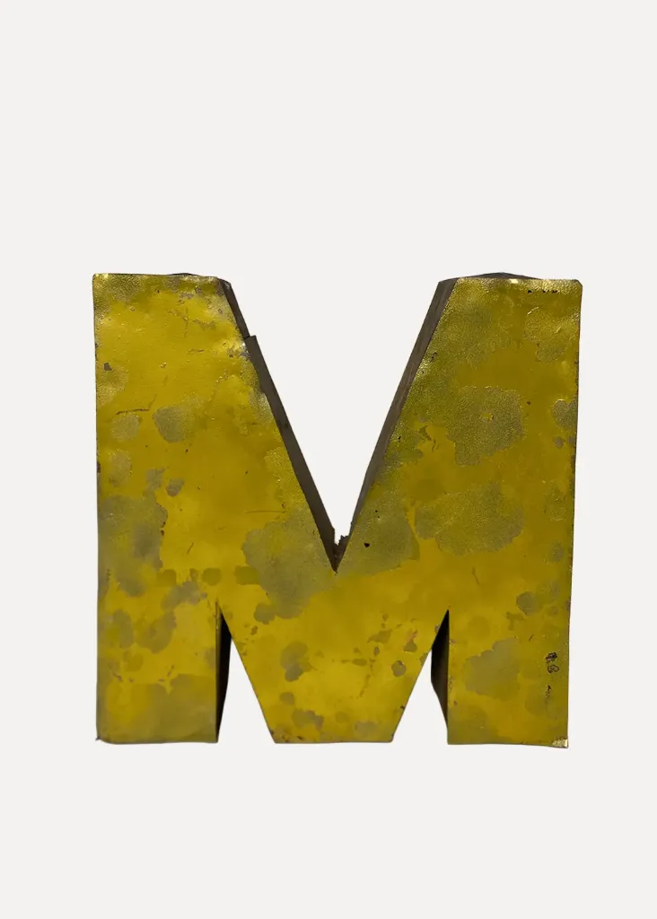 Large metal "M"