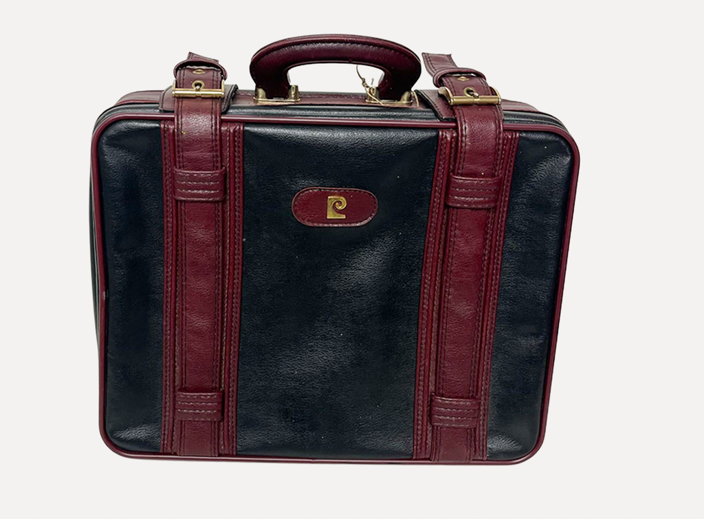 red and black leather luggage
