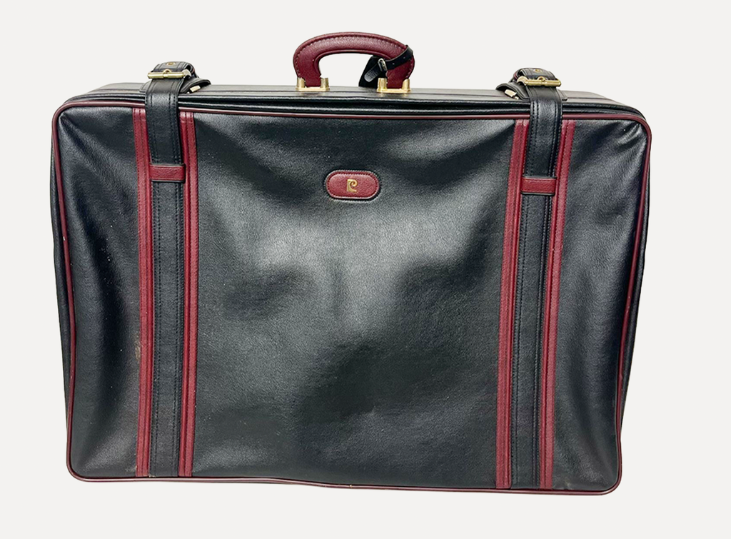 red and black leather luggage