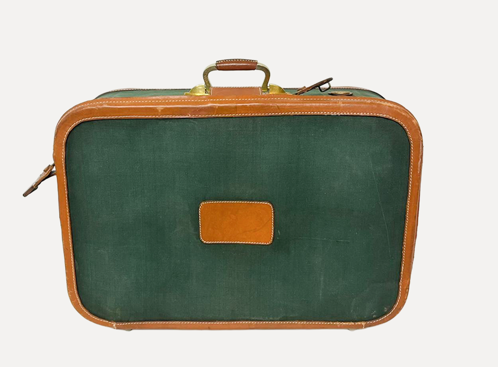 green fabric suicase luggage