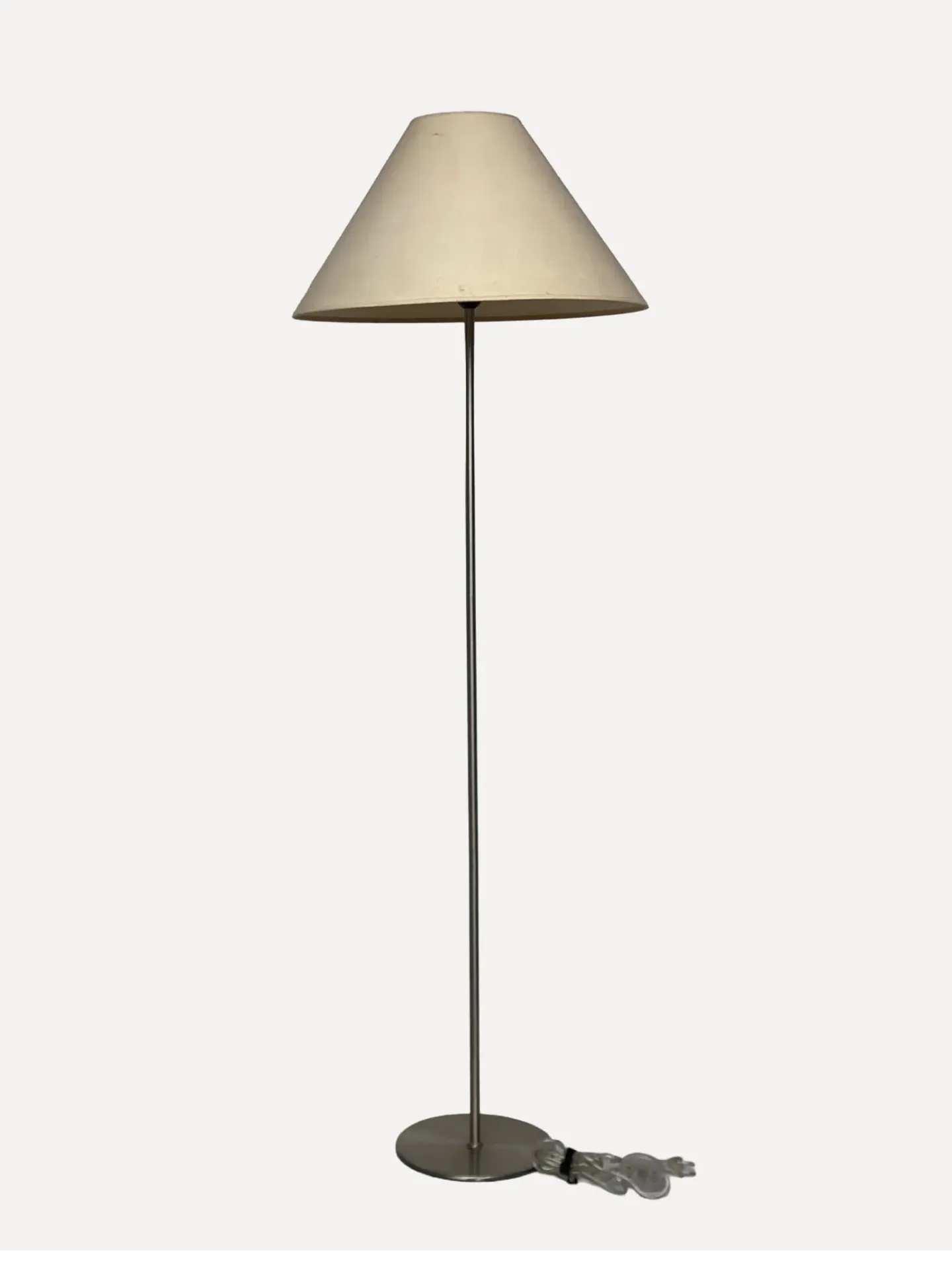 Minimalist floor lamp featuring a steel pole,