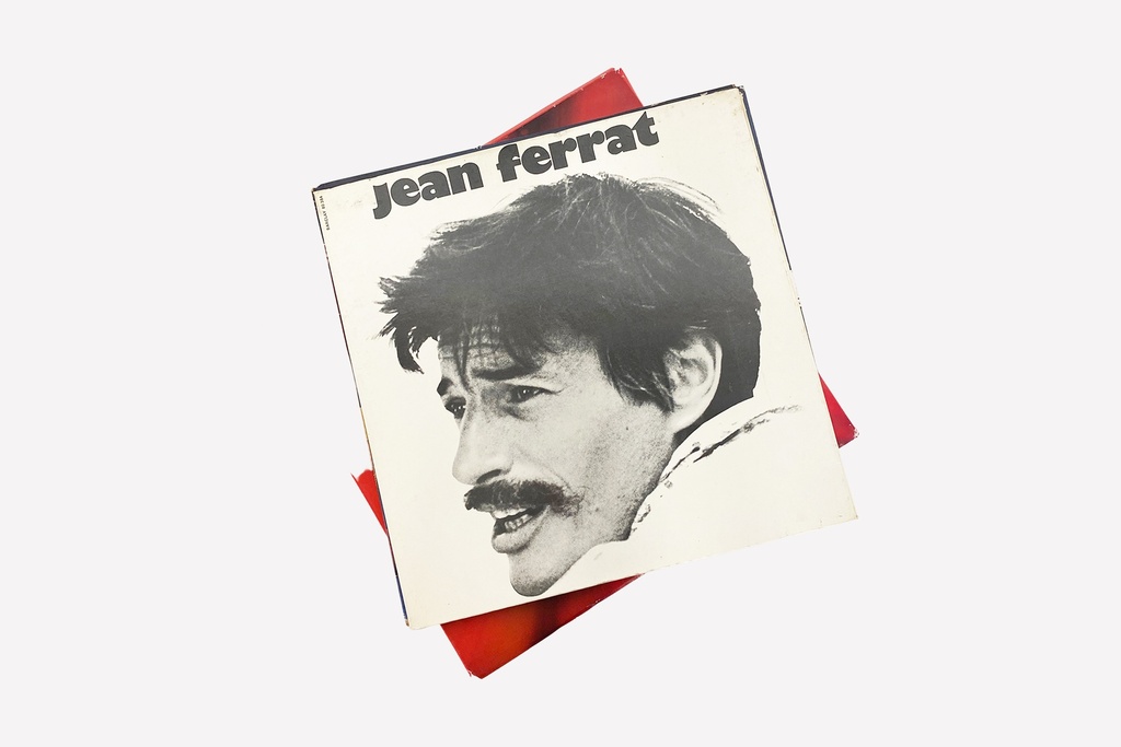 Jean Ferrat Vinyl Record Cover with Red Backdrop