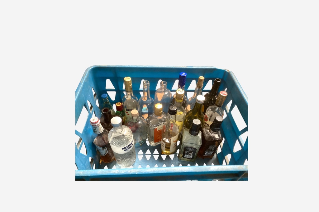 Assorted Liquor Bottles in Blue Crate
